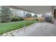 Covered patio in backyard offers ample space for entertaining outdoors with a large yard at 4391 W Tufts Ave, Denver, CO 80236