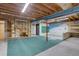 Unfinished basement with exposed wood ceiling and concrete walls, offering great potential at 4391 W Tufts Ave, Denver, CO 80236
