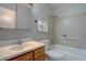 Bright bathroom featuring a sink vanity, toilet, and shower-tub combination, offering essential functionality and comfort at 4391 W Tufts Ave, Denver, CO 80236