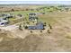 Aerial view of an expansive property featuring a large home with a circular driveway and surrounding open fields at 2937 Hidden Den Ct, Franktown, CO 80116