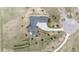 Birds eye view of home featuring grey roof and expansive concrete drive at 2937 Hidden Den Ct, Franktown, CO 80116