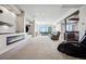 Spacious finished basement with a linear fireplace, bar area and walkout access to the yard at 2937 Hidden Den Ct, Franktown, CO 80116