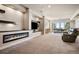 Finished basement with fireplace, media center, and sliding door to exterior at 2937 Hidden Den Ct, Franktown, CO 80116