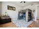 Bedroom featuring loft bed, desk, and hardwood floors at 2937 Hidden Den Ct, Franktown, CO 80116