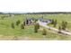 Expansive home on a large lot featuring a long driveway and well-maintained landscaping at 2937 Hidden Den Ct, Franktown, CO 80116