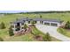 View of house featuring outdoor patio, stone facade, manicured lawns, and garage at 2937 Hidden Den Ct, Franktown, CO 80116