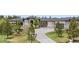 Impressive front exterior with stone accents, a spacious driveway, and mature trees for added privacy at 2937 Hidden Den Ct, Franktown, CO 80116