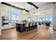 Spacious kitchen with large island, stainless steel appliances, and pendant lighting at 2937 Hidden Den Ct, Franktown, CO 80116