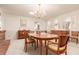 Bright dining room with a wooden table, chairs, and built-in hutch at 8211 Reed Ct, Arvada, CO 80003