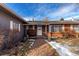 Front entrance with brick walkway and landscaping at 8211 Reed Ct, Arvada, CO 80003