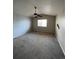 A bedroom with neutral carpeting, a ceiling fan, and natural lighting at 2242 S Uravan St, Aurora, CO 80013