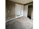This bedroom features a spacious closet and large french doors, providing ample storage and natural light at 2242 S Uravan St, Aurora, CO 80013