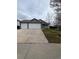 Charming home featuring a two-car garage, landscaped front yard, and a welcoming front porch at 2242 S Uravan St, Aurora, CO 80013