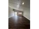 Spacious living room featuring wood-look floors, vaulted ceilings and natural light at 2242 S Uravan St, Aurora, CO 80013