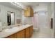 Functional bathroom features double sinks and a shower-tub combo for convenience at 4673 Perth St, Denver, CO 80249