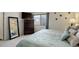 Cozy bedroom with soft carpet, dresser, and a large mirror creating an open feel at 4673 Perth St, Denver, CO 80249