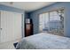 Bright bedroom features large window, closet and dresser for ample storage space at 4673 Perth St, Denver, CO 80249