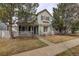 Charming two-story home featuring a cozy front porch and a well-maintained, landscaped front yard at 4673 Perth St, Denver, CO 80249