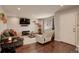 Inviting living room with hardwood floors, recessed lighting, and comfortable seating for relaxation and entertainment at 4673 Perth St, Denver, CO 80249