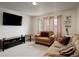 Comfortable living room with modern TV, stylish decor, and a cozy seating arrangement at 4673 Perth St, Denver, CO 80249