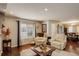 Bright living room featuring hardwood floors, natural light, and comfortable seating at 4673 Perth St, Denver, CO 80249