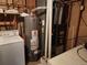 This utility room features a water heater, washer, dryer and furnace at 14702 E Security Way, Aurora, CO 80011