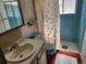 This bathroom features a single sink, toilet, and tile shower stall at 14702 E Security Way, Aurora, CO 80011