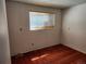 Cozy bedroom with warm-toned carpet, a window, and simple design, offering a comfortable and personal space at 14702 E Security Way, Aurora, CO 80011