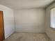 This bedroom offers neutral walls, carpeted floors, and a window for natural light at 14702 E Security Way, Aurora, CO 80011
