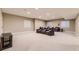 Finished basement with theater seating and a big screen TV for all your entertainment needs at 10776 Hillsboro Cir, Parker, CO 80134