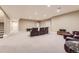 Spacious finished basement with theater seating, plush carpet, and recessed lighting. Perfect for entertainment at 10776 Hillsboro Cir, Parker, CO 80134