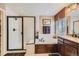 Elegant bathroom featuring a glass-enclosed shower, separate tub, and stylish fixtures in a bright space at 10776 Hillsboro Cir, Parker, CO 80134