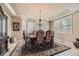 Formal dining room with a chandelier, large windows, and ample space for hosting gatherings at 10776 Hillsboro Cir, Parker, CO 80134