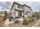 Rear exterior featuring a deck, patio, and backyard with lush landscaping at 10776 Hillsboro Cir, Parker, CO 80134
