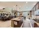 Open-concept kitchen features a granite island, stainless steel appliances, and seamless flow into the living area at 10776 Hillsboro Cir, Parker, CO 80134