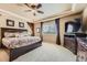 Serene main bedroom with tray ceiling, large windows, and tasteful decor providing a peaceful retreat at 10776 Hillsboro Cir, Parker, CO 80134