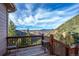 Cozy wooden deck offers stunning views of the surrounding mountains and lush green landscape at 900 Sawmill Creek Rd, Evergreen, CO 80439