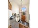 Bright foyer showcases a high ceiling, mountain view, a chandelier, and access to the living room at 900 Sawmill Creek Rd, Evergreen, CO 80439