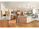 A spacious kitchen with stainless steel appliances, granite countertops, a breakfast bar, and ample natural light at 900 Sawmill Creek Rd, Evergreen, CO 80439