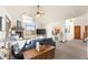 Bright living room with vaulted ceilings, a fireplace, and scenic views through expansive windows at 900 Sawmill Creek Rd, Evergreen, CO 80439