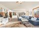 Open-concept living room with stairs to the next level, comfortable seating, and natural light at 900 Sawmill Creek Rd, Evergreen, CO 80439