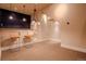 Basement area features bar seating, with decorative lighting, and transitions to the media room at 1751 Clermont St, Denver, CO 80220