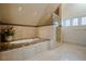 A luxurious bathroom features a soaking tub and glass shower at 1751 Clermont St, Denver, CO 80220