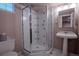 Cozy bathroom with a walk-in shower, pedestal sink, and a decorative mirror; a great space for guests at 1751 Clermont St, Denver, CO 80220