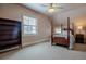 A bright bedroom with a four-poster bed, ceiling fan, and lots of light at 1751 Clermont St, Denver, CO 80220