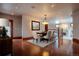Elegant dining room featuring a chandelier, hardwood floors, and access to another room at 1751 Clermont St, Denver, CO 80220