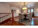 Dining room with chandelier, hardwood floors, and staircase at 1751 Clermont St, Denver, CO 80220