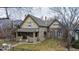 Charming two-story home with classic architectural details, well-maintained landscaping, and inviting front porch at 1751 Clermont St, Denver, CO 80220