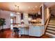 Well-designed kitchen featuring granite countertops, custom cabinetry, and a breakfast bar at 1751 Clermont St, Denver, CO 80220