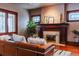 Cozy living room with a classic fireplace, plush seating, and natural light at 1751 Clermont St, Denver, CO 80220